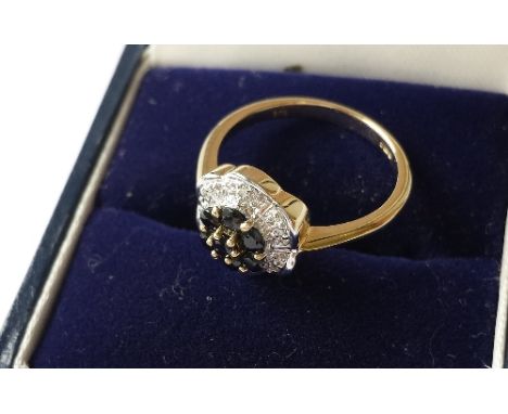 A 9ct Gold Sapphire & Diamond Floral Cluster Ring.