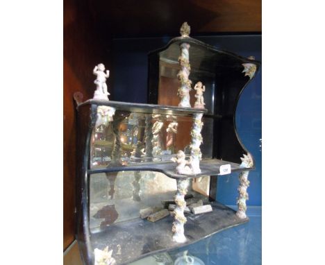 A Very Unusual 19th Century Ebonised Wall Mounted Shelves, with Dresden style porcelain pillars and mounts of shells and cher