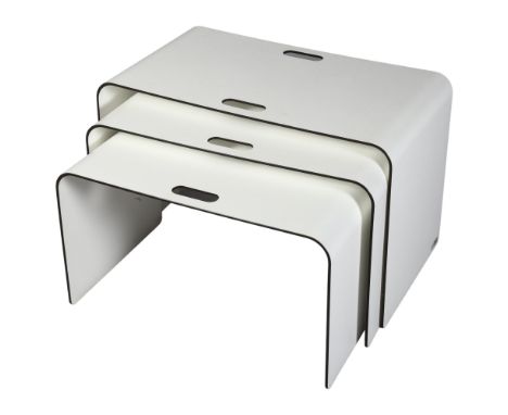 Kay Thoss, a set of 3 nesting tables, each with handle cut-outs, with maker’s label, made from laminated resin impregnated ce