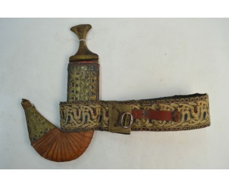 An Arab dagger jimbaya with decorative hilt and scabbard, on embroidered belt, to/w a machete with stitched leather scabbard 