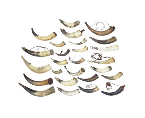 Twenty-Four Various Powder-Horns19th Century And LaterEach formed from a section of polished cowhorn, some mounted with nozzl