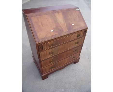 Quality reproduction mahogany bureau with fall front revealing fitted interior above four drawers, on raised bracket feet (wi