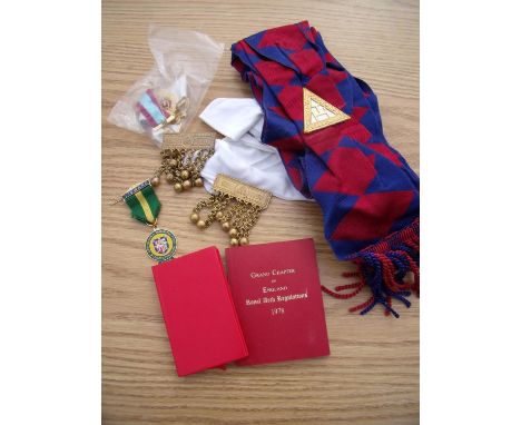 Box containing a small selection of Masonic items including sash, booklets, medals etc 