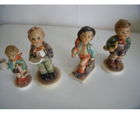 Group of four various Hummel/Goebel figures of boys 