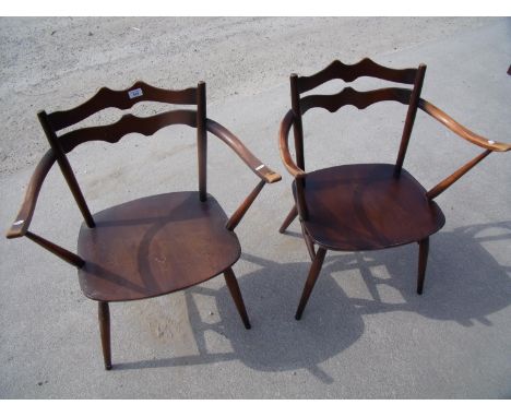 Pair of dark elm Ercol armchairs 