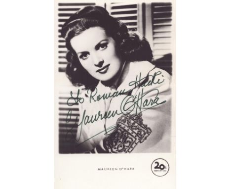 Maureen O'Hara (1920-2015), a signed and dedicated 5.5 by 3.5 inch photo postcard. She was an Irish-born naturalized American