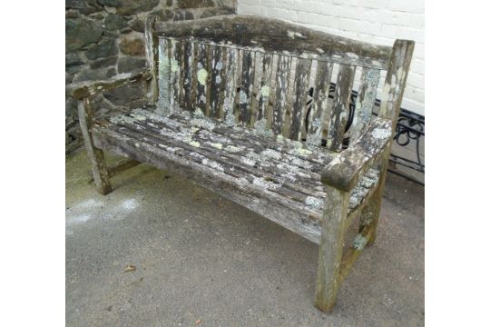 A 5' 1" teak garden bench of slatted design