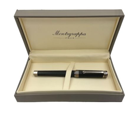 Montegrappa NeroUno fountain pen, the black barrel and cap of octagonal form with dark chrome mounts and clip with roller, an