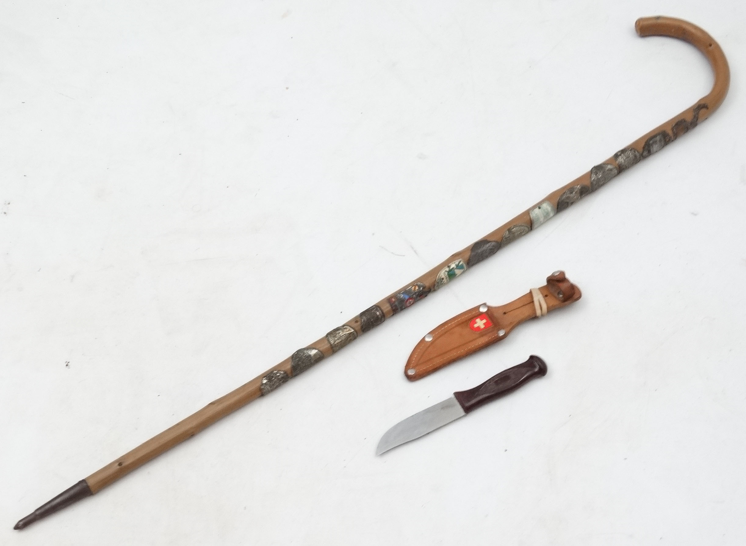 A German Walking Cane with numerous applied hiking badges , to include