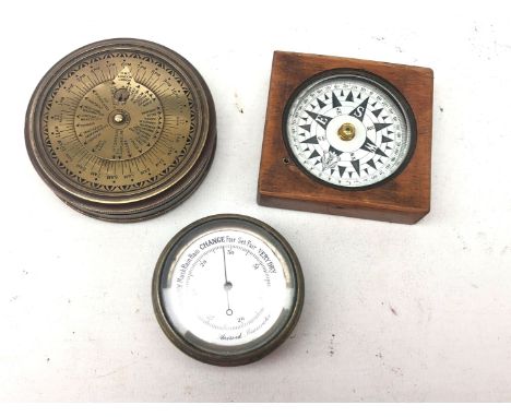 Pocket brass cased Aneroid Barometer, mahogany cased compass and a reproduction 'Stanley' brass cased compass (3) Condition R