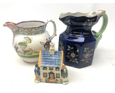 Early 19th century Pratt type money box, modelled with two figures stood outside a house, H13.5cm, Victorian pink lustre jug 