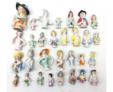 Collection of thirty ceramic pin cushion/ half dolls of varying size H11cm max Condition Report Click here for further images