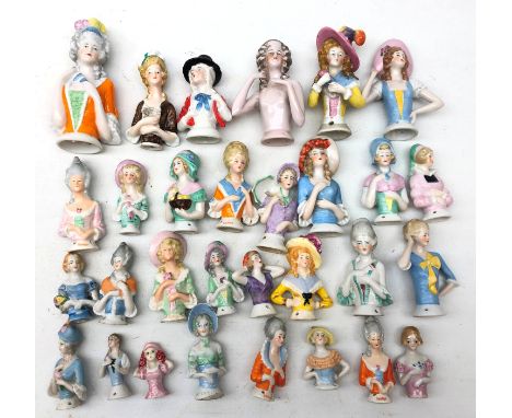 Collection of thirty ceramic pin cushion/ half dolls of varying size H12cm max Condition Report Click here for further images