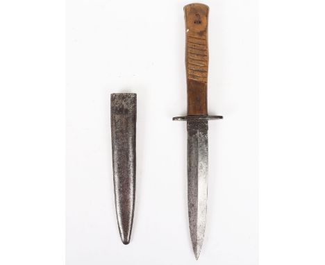 WW1 German Trench Fighting Knife: Wood grip knife  with double edge 14.5 cm blade , some pitting , housed in metal scabbard o