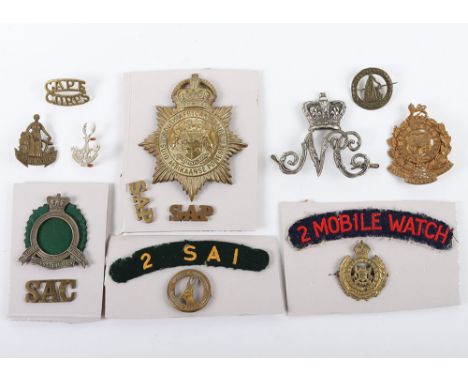 Grouping of South African Military Badges, including Victorian Natal Carbineers helmet badge, South African Constabulary hat 