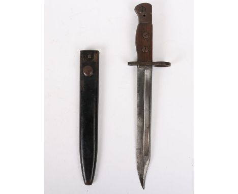 British No 5 Jungle Carbine Bayonet: Wood grip bayonet with armour marks to blade complete with metal scabbard. 