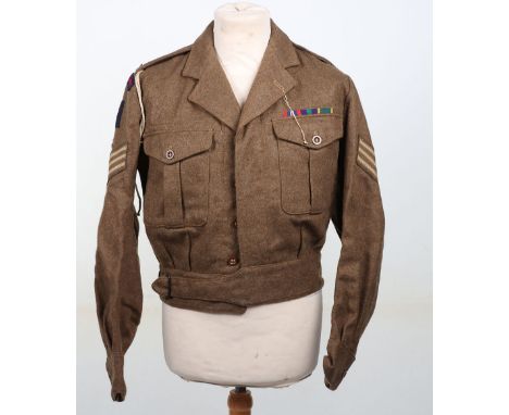 Royal Artillery Battle Dress Blouse: Dated 1961 label inside with RA  cloth titles  , brass RA and EY brass badges ,stripes a