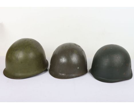 US  and USSR Steel Helmets: US steel M1 combat helmet with front seam and swivel loops and fiber liner being stamped US to in