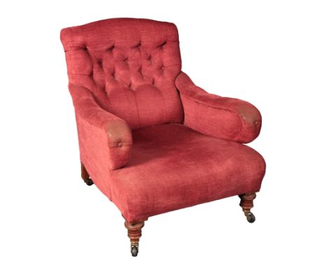 A HOWARD TYPE ARMCHAIR with button back maroon chenille covers, on turned front legs and outswept rear legs terminating in ca