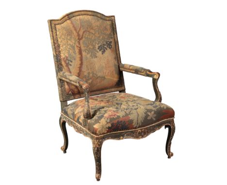 A LOUIS XV STYLE GREEN-PAINTED AND PARCEL-GILT ARMCHAIR with verdure tapestry covers, the square back over shaped and padded 