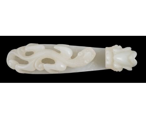 A Chinese white jade ‘dragon’ belt hook, 18th/19th century, carved in relief and openwork with a chilong and a dragon head te