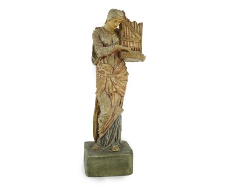 A Compton tempera painted pottery figure of St Cecilia, early 20th century, impressed factory mark to base, 31.5cm high, loss