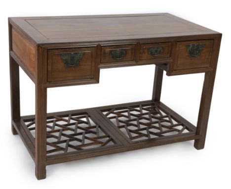 A Chinese huanghuali and hongmu desk, 19th century, with inset rectangular top and four frieze drawers with original engraved