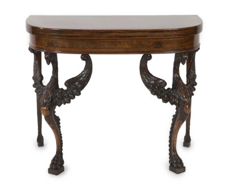 A mid 18th century style walnut card table with crossbanded D shaped burr wood top, on winged eagle legs and rounded tapered 
