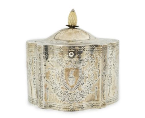A George III engraved silver tea caddy, by Benjamin Mountigue, of serpentine form, with carved ivory pineapple finial and but