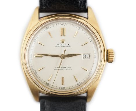 A gentleman's late 1940's 18ct gold Rolex Oyster perpetual chronometer bubble back wrist watch, with baton numerals and date 