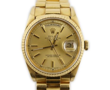 A gentleman's late 1980's 18ct gold Rolex Oyster Perpetual Day/Date wrist watch, on an 18ct gold Rolex bracelet with deployme