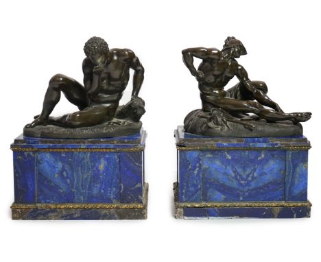 After the antique, a pair of late 18th/early 19th century Grand Tour souvenir bronze figures of seated warriors each upon nat