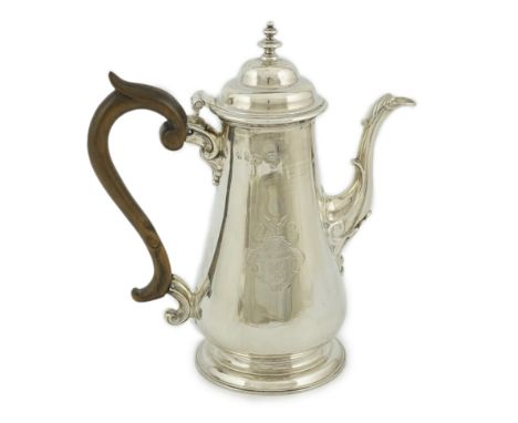 A George II silver coffee pot, possibly by William &amp; Robert Peaston, of tapering form, with engraved crest, hinged domed 