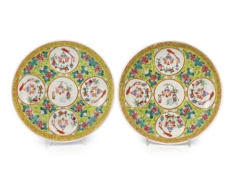 A pair of Chinese yellow ground medallion saucer dishes, Guangxu six character marks, early 20th century, each painted with a