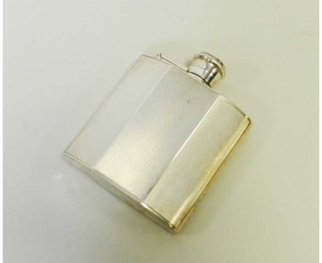 An engine turned silver hip flask, William Suckling Ltd, London 1947, of faceted form with hinged screw cap, 10cm high, weigh