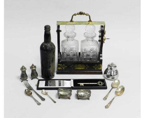 A collection of silver cruets, comprising two salts and two pepperettes, together with a cased presentation white metal key, 