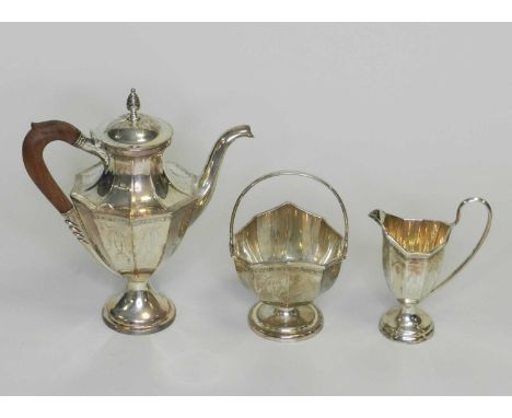 A Neoclassical style three piece silver tea service, London Assay Office, import date marks for 1975 and 1984, comprising; a 
