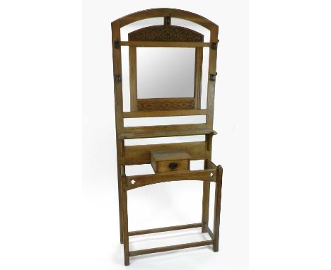 An Edwardian pale oak hall stand, pierced with quartrefoils and carved with an oval chain,198cm high x 84cm wide x 31cm deepC