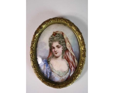 Late 18th Century miniature portrait of a lady wearing a blue dress and powdered wig, on enamel, oval, measurements 8.5 x 6.5