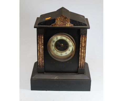 A Victorian black slate and rouge marble 8-day mantel clock, the dial with enamel chapter ring showing Arabic numerals, on pl