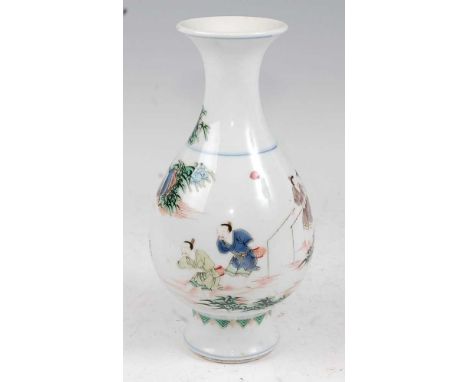 A Chinese Famille Verte vase having a flared rim to slender neck and bulbous lower body enamel decorated with various figures
