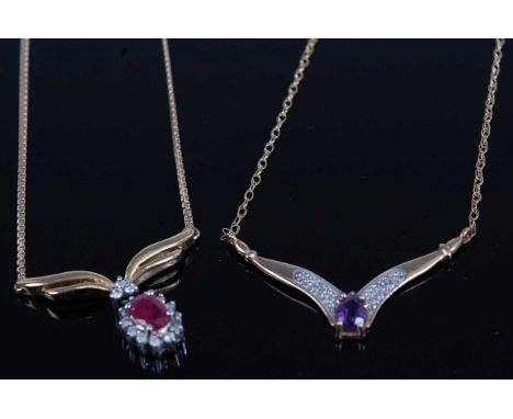 A 9ct gold, ruby and diamond point set pendant, on finelink neck chain, diamond weight stated as 0.15 carats, 3.8g; together 