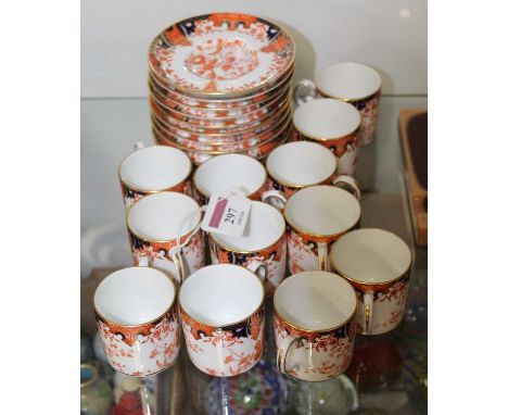 A set of twelve Royal Crown Derby coffee cans and saucers, in the Imari pattern, No.2712