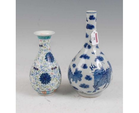 A Chinese export blue &amp; white bottle vase of typical form decorated with mythical figures within clouds having four chara