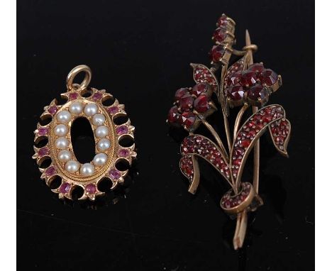 An Edwardian yellow metal seed pearl and ruby set pendant, 3.3g, 2.7cm together with a gilt metal and garnet set leaf and flo