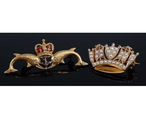 A contemporary Royal Navy Submarine Service 9ct gold and enamel brooch, set as two dolphins flanking a crown above an anchor,