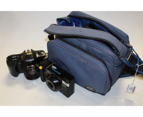An Olympus OM101 Power Focus camera, together with a Miranda 530 TZ flash, a Konica MR70 camera, in fitted camera bag