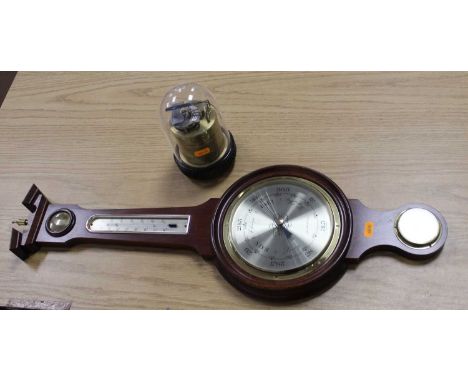 A reproduction mahogany wheel barometer, the broken arch pediment with finial above four glass dials, height 73cm, together w