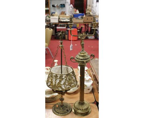 A brass twin light table lamp, surmounted by a Greek style twin handled urn, on a fluted column and domed base, h.77cm (exclu