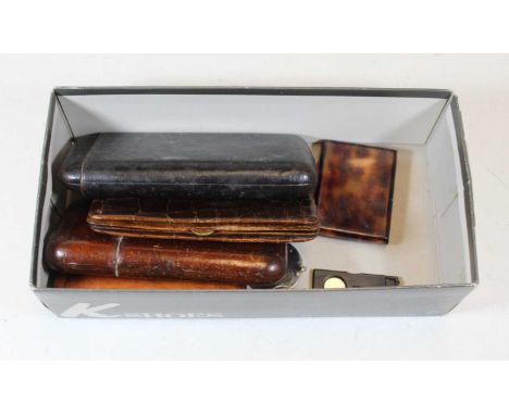 A Dunhill steel cigar cutter, of circular form; together with three leather cigar cases, a leather wallet, and a faux tortois